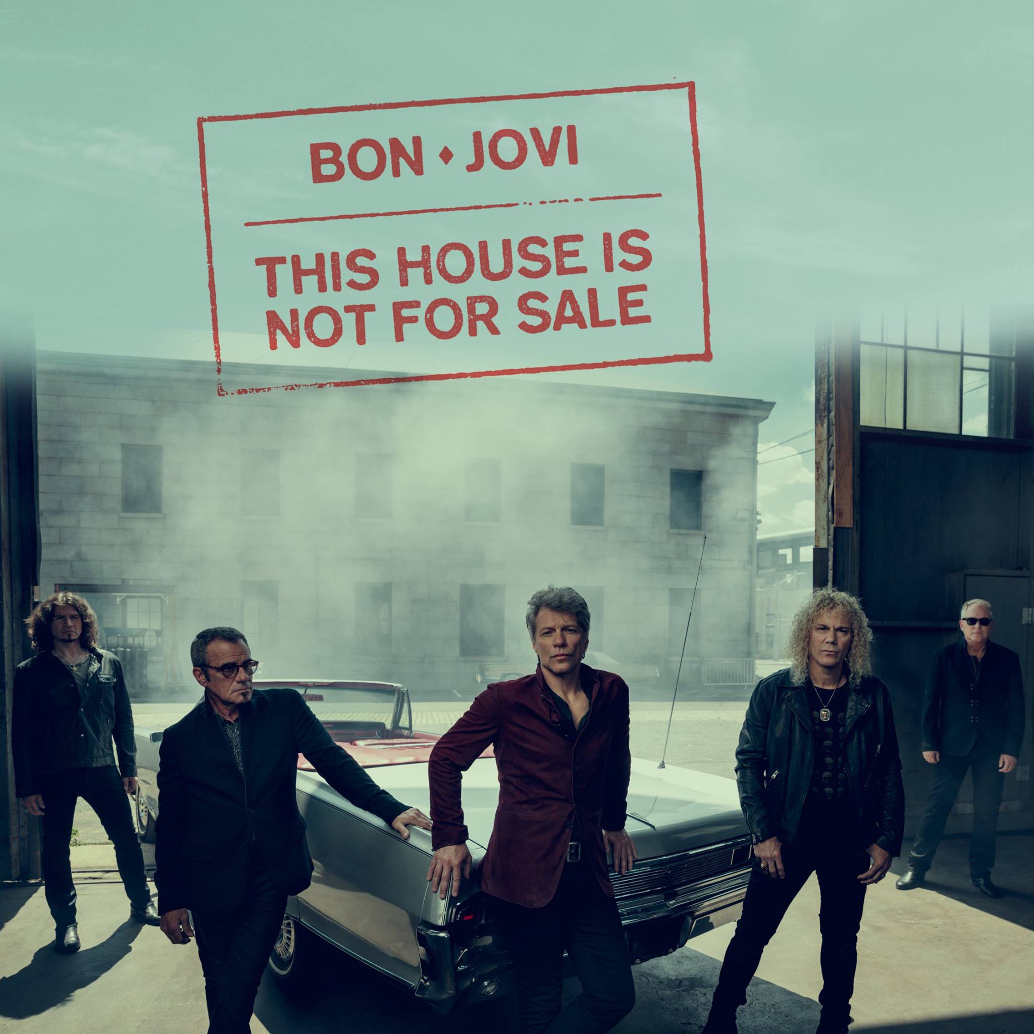 A group photo of Bon Jovi taken in 2016.